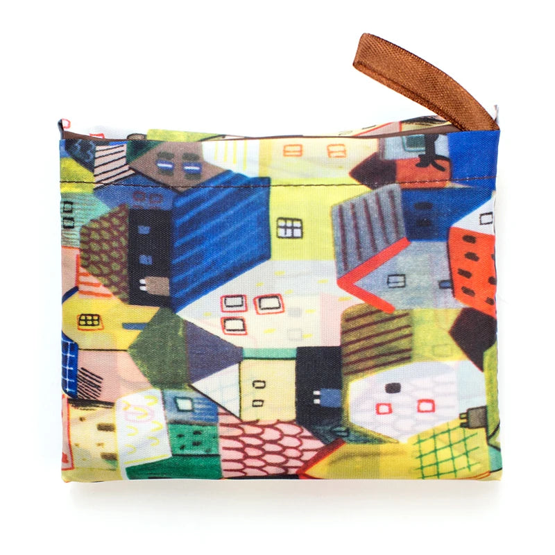 Colorful geometric pattern pouch featuring houses in various styles, perfect for organizing small items.