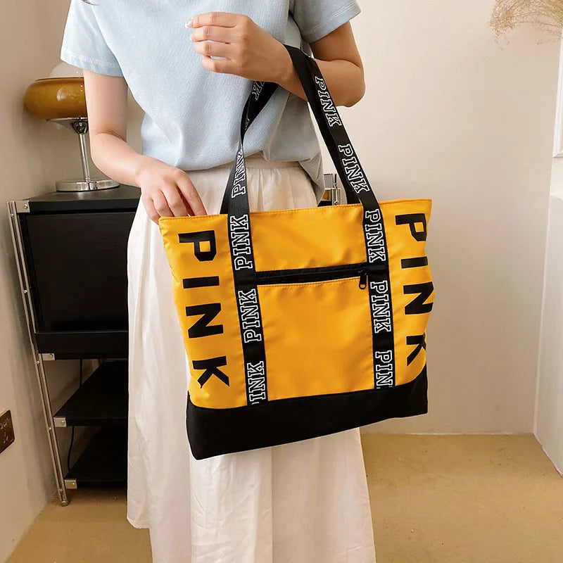 Leisure Large Capacity Tote Bag for Women Shoulder Bags in yellow and black with PINK branding and zipper closure.