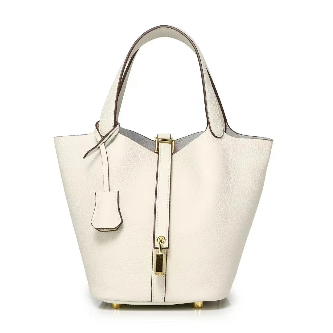 New Leather Luxury Handbag, High-end in elegant white color with a bucket shape and zipper closure.