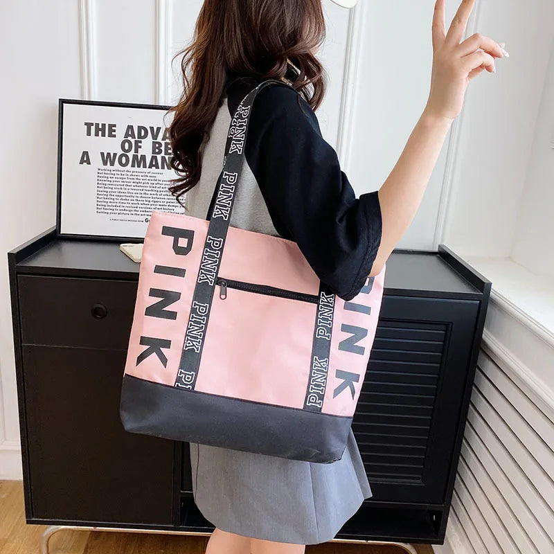 Leisure Large Capacity Tote Bag for Women Shoulder Bags in pink and black with logo detailing.