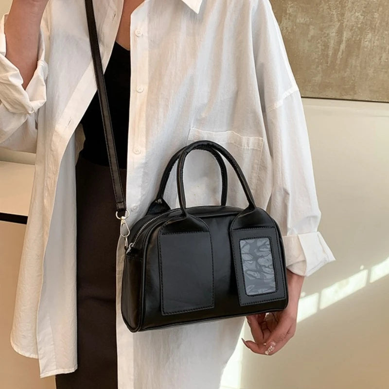 2026 New Y2K Harajuku Shoulder Bag Women in stylish black design and held by a model.