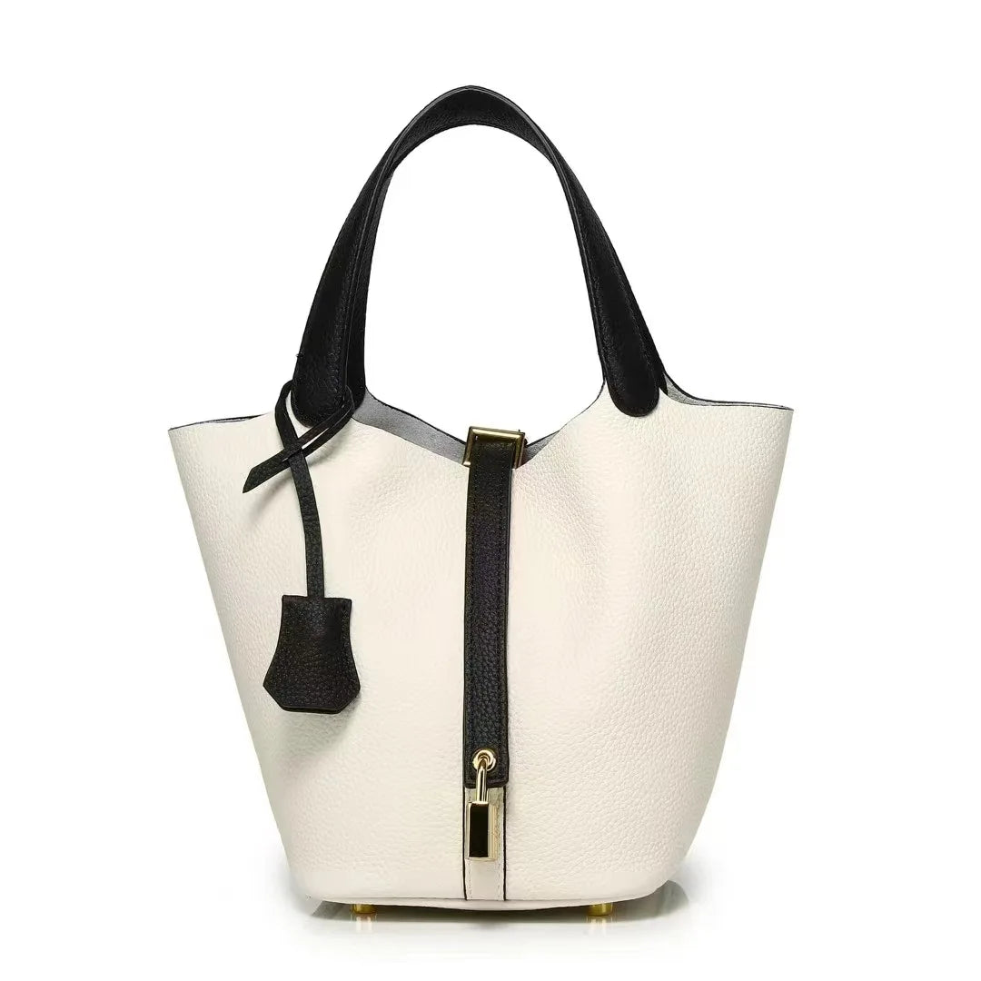 New Leather Luxury Handbag, High-end in white with black accents and zipper closure.