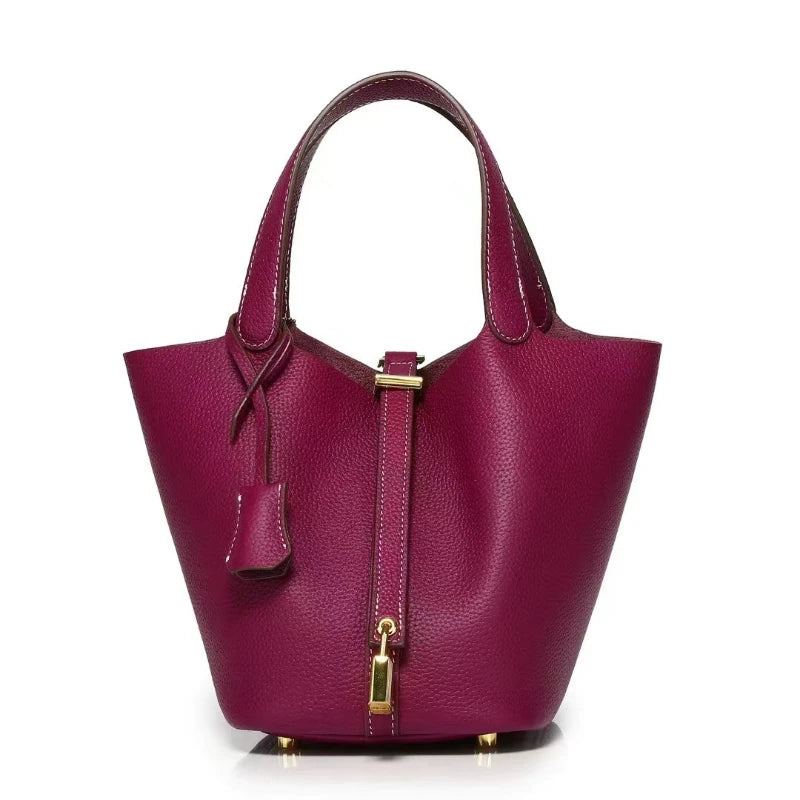New Leather Luxury Handbag, High-end in vibrant purple with zipper closure and bucket shape.