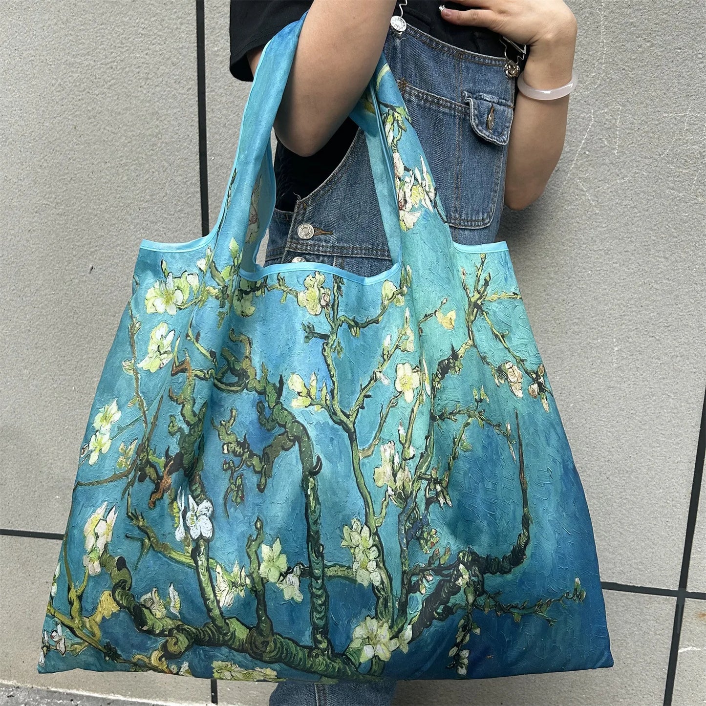 Large Foldable Shopping Bag New Fashion featuring a floral design and vibrant colors.