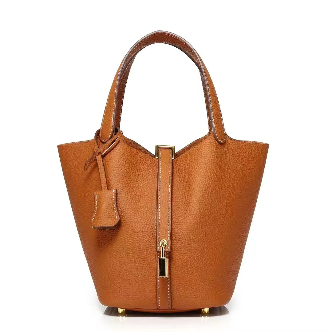 New Leather Luxury Handbag, High-end in brown bucket shape with zipper closure, perfect for leisure travel.