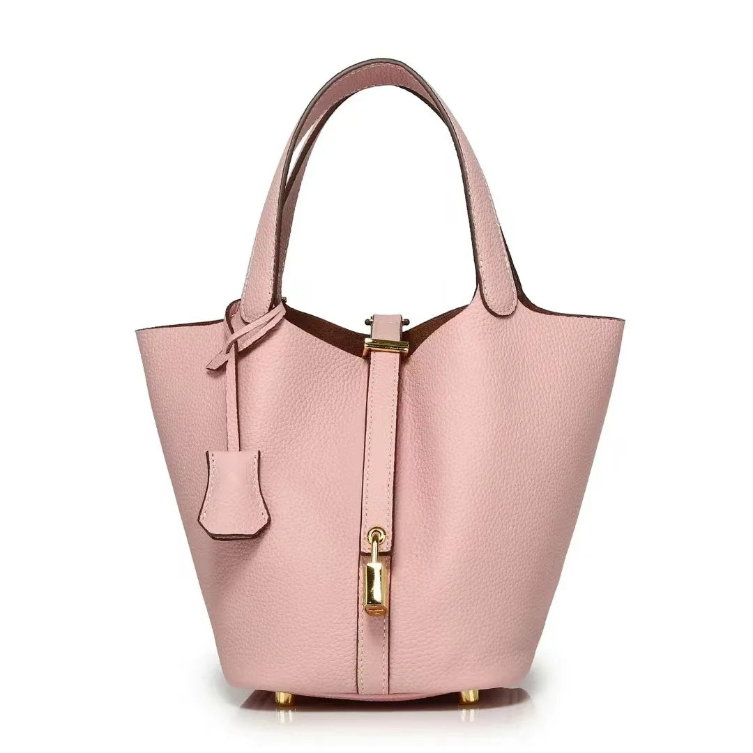 New Leather Luxury Handbag, High-end in pink bucket shape with zipper closure and solid exterior.